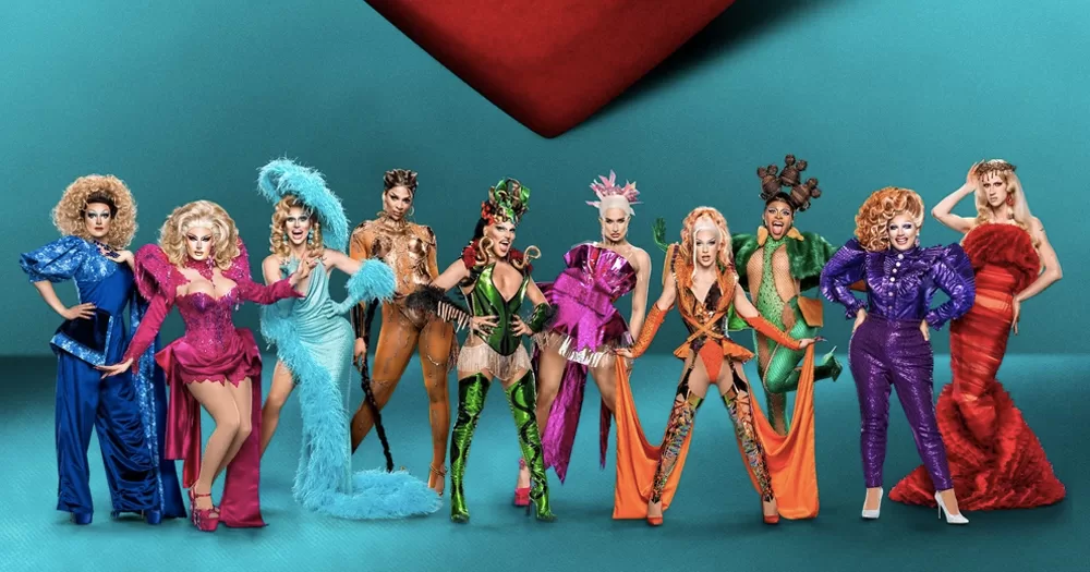 The cast of Drag Race UK season 5, as fans speculate that one queen was edited out of the first episode. In the photo, ten drag queens pose in colourful outfits.